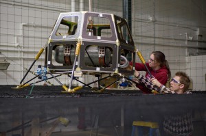Engineers prepare the Hover Test Vehicle for ground tests.  