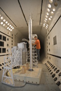 Thomas Ivanco prepares a model of Ares I-X for testing in the Transonic Dynamics Tunnel at NASA’s Langley Research Center.  