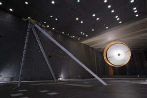 The parachute for NASA’s Mars Science Laboratory (MSL) being tested inside the world's largest wind tunnel at Ames Research Center. An engineer is dwarfed by the parachute, the largest ever built to fly on an extraterrestrial flight. 