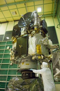 An engineer looks on as the stacked STEREO spacecraft undergo a spin balance test. 