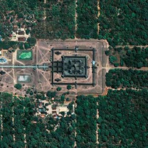 Thanks to radar technology on satellites and shuttles that can penetrate tree canopies, vegetation, clouds, and the dark of night, (footnote 3) archaeologists can study the city of Angkor in Cambodia. The Angkor complex is hidden beneath a dense rainforest canopy, making it difficult for researchers on the ground to study the ancient city. The ancient Angkor Wat temple shown here is considered one of the most valuable architectural sites in Asia. Angkor Wat, built by Suryavarman II between 1113 and 1150 AD, is the pinnacle of the city of Angkor, capital of the once- powerful Khmer Empire of Southeast Asia.