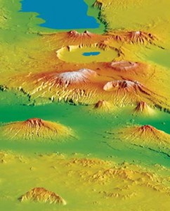 The view from space has allowed NASA to map the terrain of Earth, which has important safety implications for the aviation industry; poor visibility combined with uncertainty about terrain causes more than fifty percent of fatal aviation accidents. (footnote 4) This view of the Crater Highlands along the East African Rift in Tanzania, obtained from NASA’s Shuttle Topography Mission, shows landforms using color and shading. Color indicates height, with lowest elevations in green and highest elevations in white, and shading shows the slope. 