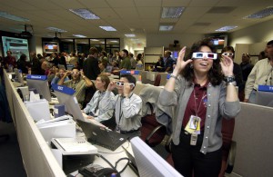 Men and women of the Mars Exploration Rover mission admire some of Spirit's first images in 3-D. Photo Credit: NASA