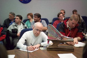 Space Shuttle Mission Management Team members take notes during an eight-day simulation at Johnson Space Center in March 2005, preparing for Return-to-Flight mission STS-114. Photo Credit: NASA