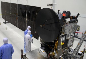 At Astrotech, workers check the Dawn spacecraft after testing the deployment of its more than 32-foot-long solar panels on one side.  