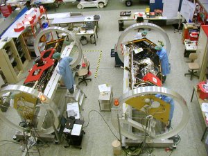 View of the twin satellites in a clean room.  
