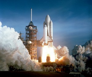 The April 12 launch at Pad 39A of STS-1, just seconds past 7:00 a.m., carries astronauts John Young and Robert Crippen into an Earth orbital mission scheduled to last for fifty-four hours, ending with an unpowered landing at Edwards Air Force Base in California.  