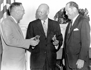 There are no photos of President Dwight D. Eisenhower signing the National Aeronautics and Space Act on July 29, 1958. According to Public Papers of the Presidents, he released a statement upon signing the bill. This usually means that he did not deliver the statement in person, so there was no ceremony. The other two men in the photo are T. Keith Glennan and Hugh L. Dryden. The photo was taken at the swearing-in ceremony for Glennan as administrator of NASA and Dryden as deputy administrator that took place in the White House Conference Room on August 19, 1958. 