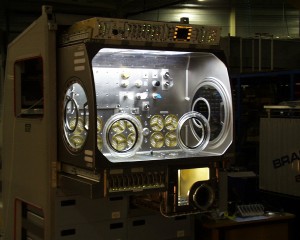 Interior lights illuminate the Microgravity Science Glovebox, developed by the European Space Agency and NASA for use aboard the International Space Station.  