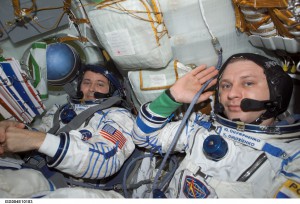 Astronaut Daniel W. Bursch (left) and cosmonaut Yury I. Onufrienko, Expedition Four flight engineer and mission commander respectively, wearing Russian Sokol suits in the Soyuz 3 spacecraft that is docked to the International Space Station.  
