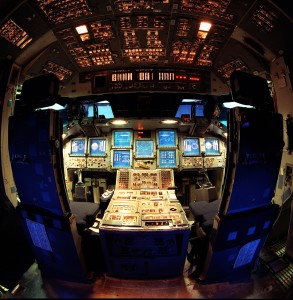 This “fish-eye” view shows NASA’s Multifunction Electronic Display Subsystem (MEDS), otherwise known as the “glass cockpit.” The fixed-base Space Shuttle mission simulator in the Johnson Space Center’s Mission Simulation and Training Facility was outfitted with MEDS to be used by flight crews for training.  