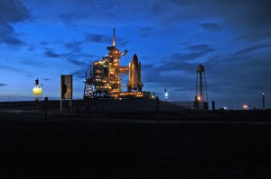 Launch Pad 39B and Space Shuttle Atlantis glow in the dusk.  