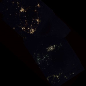 Above: A mosaic from the southern tip of South Korea (upper left) to the northern Kyushu coast of Japan (lower right). Fishing boats using bright Xenon lights are in the sea between South Korea and Japan with some lights blurred by sea fog. Bright Xenon lights are used at nighttime to lure squid into nets.