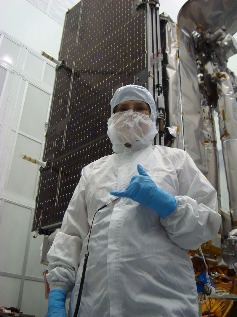 LRO Deputy Project Manager Cathy Peddie stands in front of LRO in a clean room.