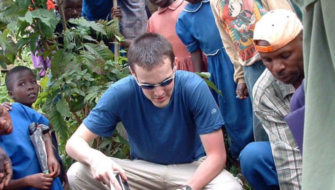 EWB-JSC volunteer Evan Thomas working in Muramba, Rwanda, to assess a surface-water pipeline.