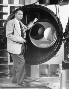 H. Julian Allen stands beside the observation window of the 8-foot-by-7-foot test section of the NACA Ames Unitary Plan Wind Tunnel. Allen is best known for his "blunt-body theory" of aerodynamics, a design technique for alleviating severe reentry heating problems.