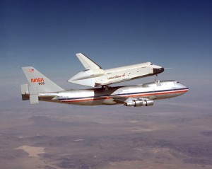 The Space Shuttle prototype Enterprise rides smoothly atop NASA's first shuttle carrier aircraft, NASA 905, during the first of the shuttle program's approach and landing tests at Dryden Flight Research Center in 1977.