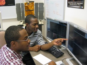 Bowie State University students Darrell Washington and Kevin Gross at the controls during a NASA satellite contact.  