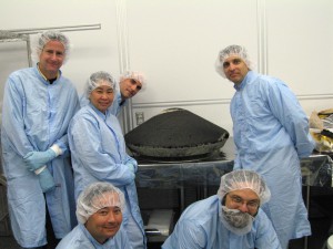 NASA Ames researchers at the Johnson Space Center curation facility with the recovered Stardust sample-return capsule heat shield.  