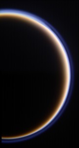 Titan’s golden, smog-like atmosphere and complex layered hazes appear to Cassini as a luminous ring around the planet-sized moon. (