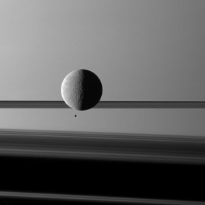 Saturn's moon Rhea looms "over" a smaller and more distant Epimetheus.