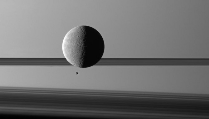 Saturn's moon Rhea looms "over" a smaller and more distant Epimetheus.