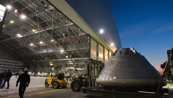 A mock-up of the Orion space capsule heads to its temporary home in a hangar at Langley Research Center.