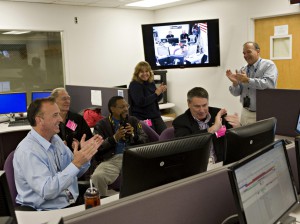 (Left to right) John Marmie, Jack Boyd, Lewis Braxton III, Tina Panontin (standing), Pete Worden, and Chuck Duff celebrate LCROSS’s separation from the Centaur upper stage. 