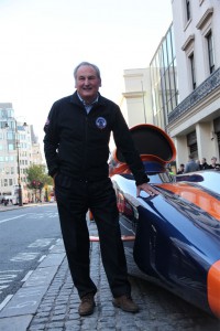 Project Director Richard Noble stands with the Bloodhound SSC show car outside Coutts Bank in The Strand, London.