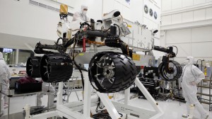Engineers working in a clean room at the Jet Propulsion Laboratory installed six new wheels on the Curiosity rover. 