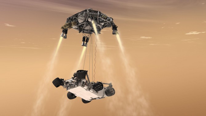 This artist’s concept shows the sky crane maneuver during the descent of the Curiosity rover to the Martian surface.