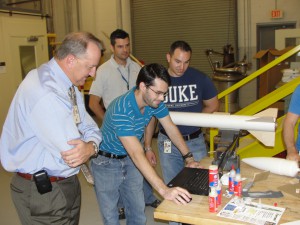 The RU team shows the Kennedy Space Center Engineering director the analysis associated with the team’s first certification build. 