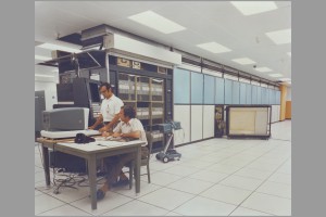 Quadrant of ILLIAC IV, the first large massively parallel computer, with V. Tosti (standing) and S. Kravity. 