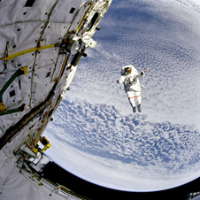 Astronaut Mark C. Lee tests the Simplified Aid for EVA Rescue (SAFER) system