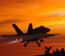 Hornet launches at sunset