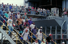 Shipyard workers depart the USS Harry S. Truman