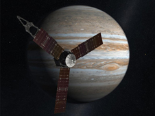 Artist concept of Juno spacecraft in front of Jupiter