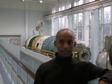 Lealem Mulugeta standing near the MIR Mockup in Moscow, Russia.