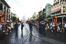 With Cinderella's castle in the background, the seven STS-118 crew members march down Main Street at Walt Disney World's Magic Kingdom theme park.