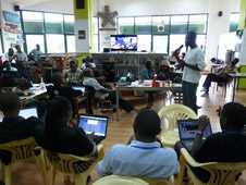 International Space Apps Challenge participants discuss the solutions to challenges at the iHub in Nairobi, Kenya on April 22, 2012.