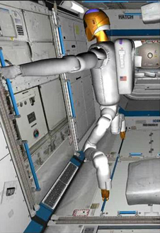 Image of R2 working inside of the International Space Station with its climbing legs locked into a track configuration.