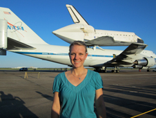 C.J. Kanelakos, mechanical engineer at Johnson Space Center, with the Space Shuttle Endeavour in the background in 2012.