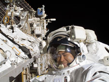 Japan Aerospace Exploration Agency Astronaut Aki Hoshide participates in a third session of extravehicular activity. During the 6-hour, 28-minute spacewalk, Hoshide and NASA Astronaut Sunita Williams (out of frame) completed the installation of a main bus switching unit that was hampered by a possib