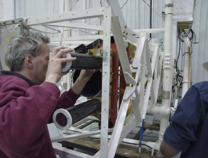 Brian Ramsey, lead scientist for the High-Energy Replicating Optics program, installs the mirrors that in May 2001 collected the world’s first focused high-energy X-ray images of any astronomical object. The Marshall-fabricated mirrors, a special type called “grazing incidence,” are nested cylinders with extremely smooth inner surfaces that reflect high-energy X-rays at very shallow angles.