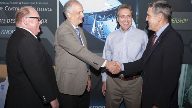 NASA APPEL Director Dr. Ed Hoffman shakes hands with Kennedy Space Center Director Bob Cabana. (From left to right: Stephen Angelillo, ACE Director, Ed Hoffman, APPEL Deputy Director Roger Forsgren, Bob Cabana.)