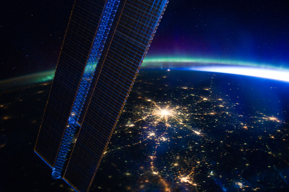 Moscow appears at the center of this nighttime image photographed by the Expedition 30 crew aboard the International Space Station, flying at an altitude of approximately 240 miles on March 28, 2012. A solar array panel for the space station is on the left side of the frame. The view is to the north-northwest from a nadir of approximately 49.4 degrees north latitude and 42.1 degrees east longitude, about 100 miles west-northwest of Volgograd. The Aurora Borealis, airglow and daybreak frame the horizon.
