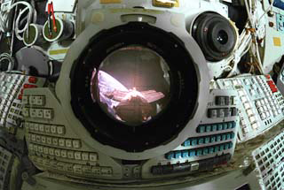 View looking through Mir Space Station Base Block periscope with the Spektr module and Earth limb in view.