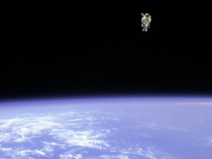 On Feb. 12, 1984, astronaut Bruce McCandless, ventured further away from the confines and safety of his ship than any previous astronaut had ever been. This space first was made possible by a nitrogen jet propelled backpack, previously known at NASA as the Manned Manuevering Unit or MMU. After a series of test maneuvers inside and above Challenger's payload bay, McCandless went "free-flying" to a distance of 320 feet away from the Orbiter. This stunning orbital panorama view shows McCandless out there amongst the black and blue of Earth and space.