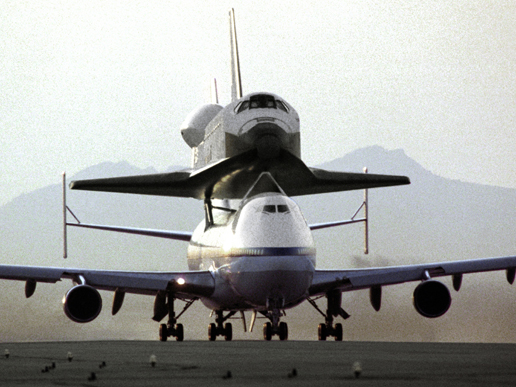 Endeavour sits atop the Shuttle Carrier Aircraft (a modified 747) in Palmdale, California, where the orbiter was built, ready for delivery to NASA's Kennedy Space Center, Florida in May 1991. A little more than a year later, Endeavour launched on its maiden flight, STS-49, an extended mission that featured four spacewalks to repair a satellite.