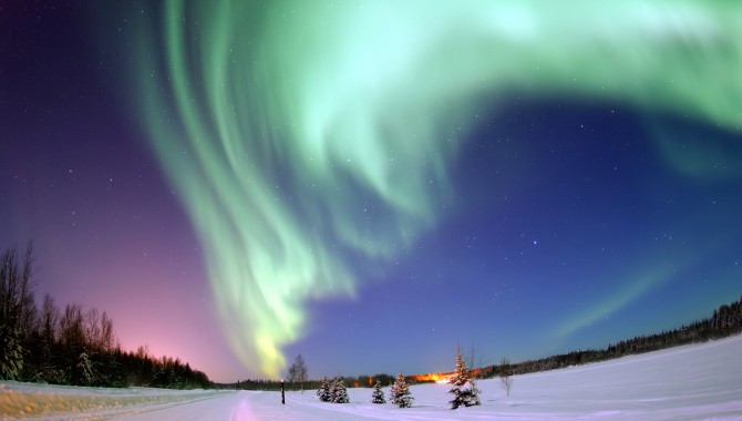 Above Bear Lake, Alaska, the Northern Lights, or aurora borealis, are created by solar radiation entering the atmosphere at the magnetic poles. The appearance of these lights is just one way solar radiation affects us; it can also interfere with NASA missions in low-Earth orbit. To achieve long-duration human spaceflight missions in deeper space, several NASA centers are working to find better safety measures and solutions to protect humans from space radiation.